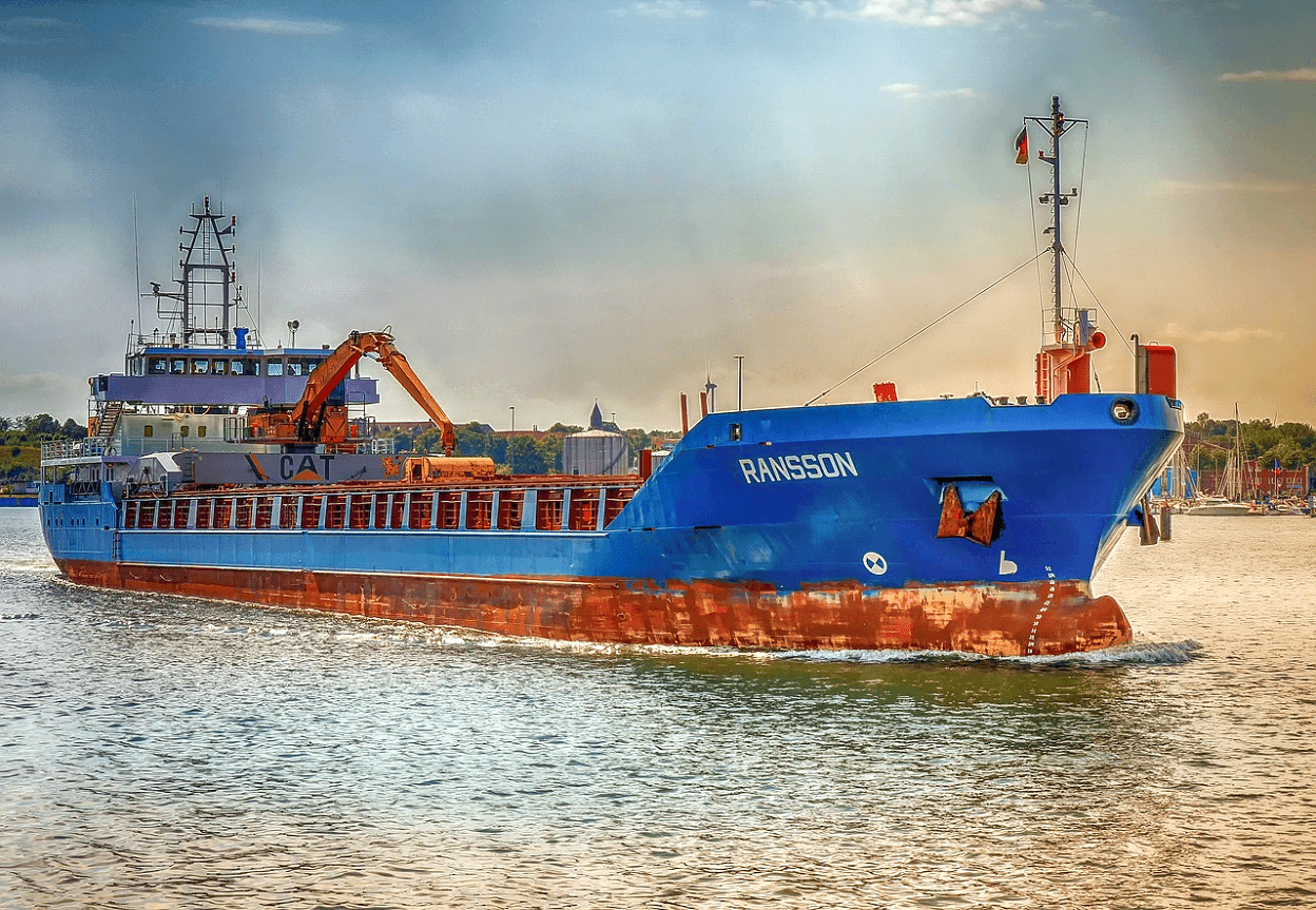 Form MCS-150 being completed against a backdrop of sea transportation